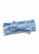 The Dream Come True Hailey Headband in a soft, glowing pink with storybook sparkle.