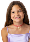 The Pink Chloe Choker with 18K Gold Plated Charm in a classic, playful pink with everyday charm.