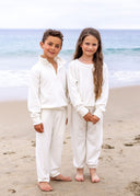 The Cloud White Grayson Pant featuring pair it with the Andrew Collared Pullover for a cozy set designed for lounging, play, and everything in between.