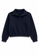 The Deep Tide Andrew Collared Pullover in a rich, inky blue inspired by the ocean at dusk.